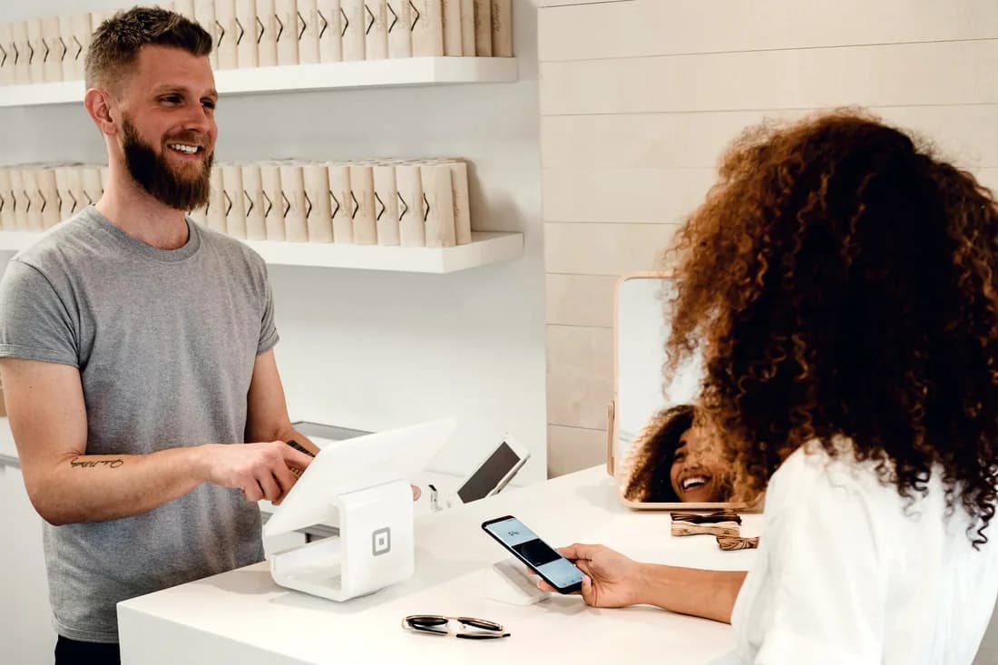 Small-business owner taking a card payment