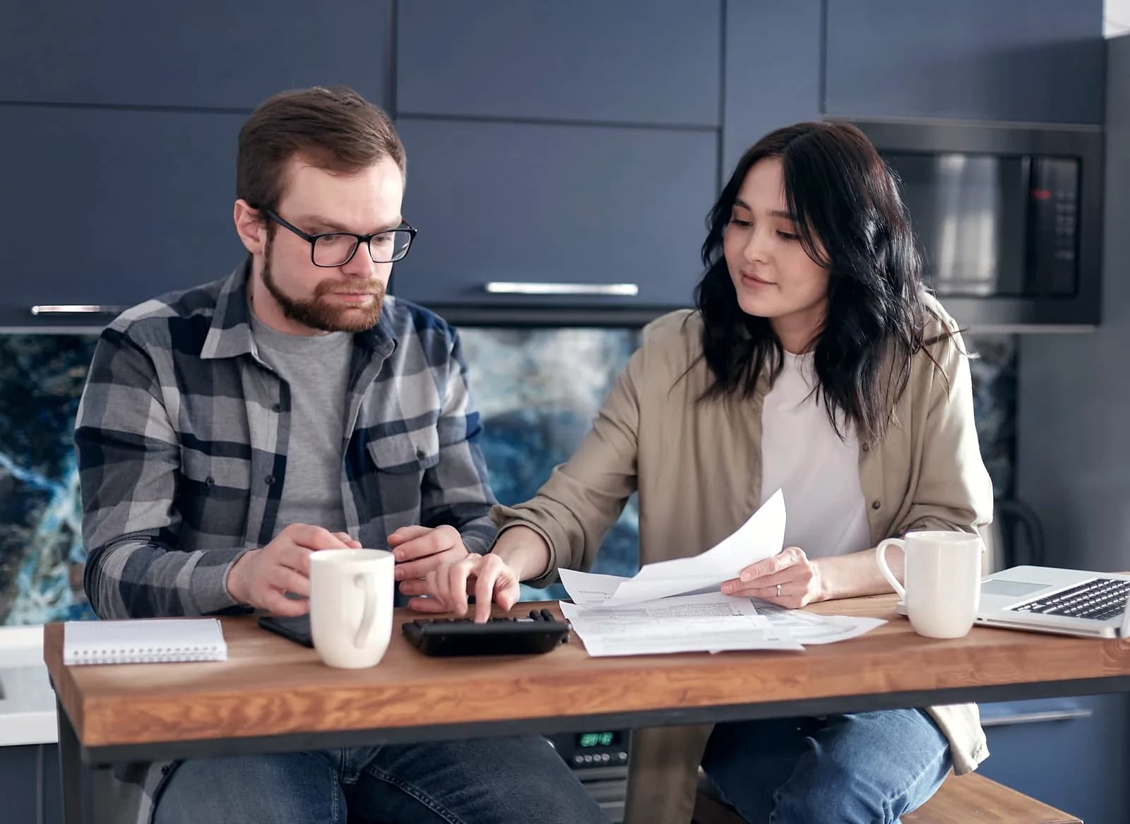 Couple planning their finances together at home