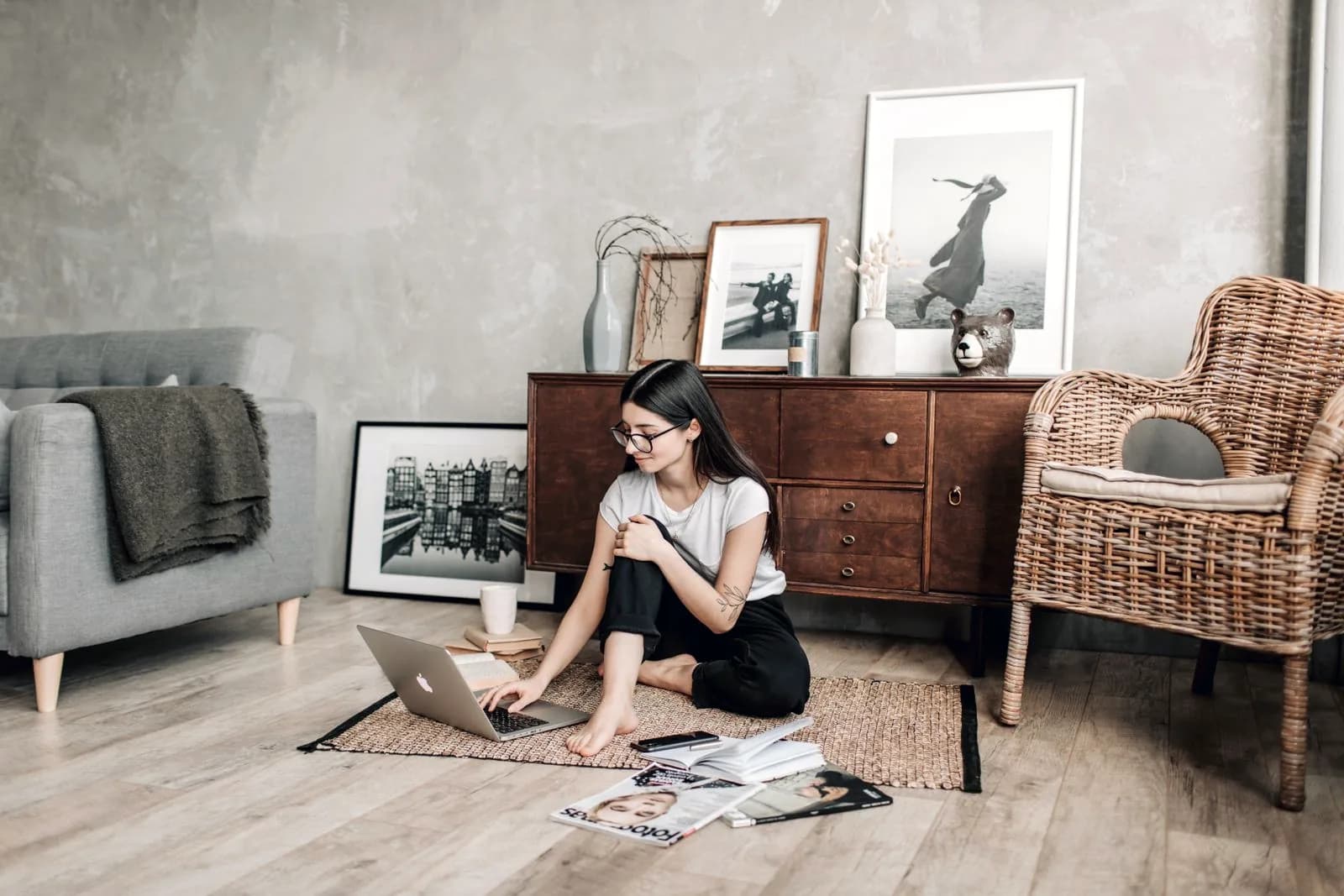 Woman reviewing her finances on a laptop at home